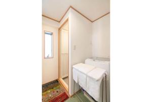 Postel nebo postele na pokoji v ubytování Travel Palace Miyuki