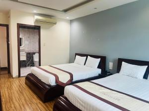 Ένα ή περισσότερα κρεβάτια σε δωμάτιο στο Khách Sạn Avatar