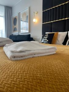 Posteľ alebo postele v izbe v ubytovaní Solne Apartamenty A247 z klimatyzacją Solny Resort