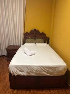 A bed or beds in a room at Lima ciudad de los reyes