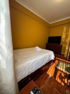 A bed or beds in a room at Lima ciudad de los reyes