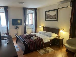 Katil atau katil-katil dalam bilik di Apartments Kotor Old Town