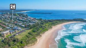 an aerial view of a beach and the ocean at Yamba Daze Sunset in Yamba