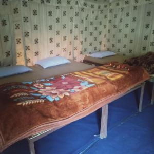 a large bed in a room with at GREEN VALLEY CAMPING & ADVENTURE in Nainital