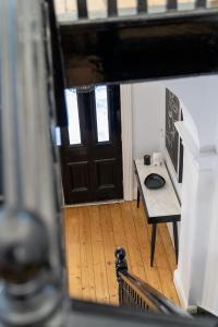 a view of a room with a table and a door at The White House - Heritage Style Terrace in Molong