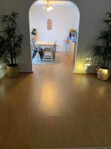 a room with a table and a dining room with a table and chairs at Nice and Cozy living Homestay in Cranbourne