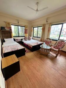 Voodi või voodid majutusasutuse Cherry Garden Pokhara toas