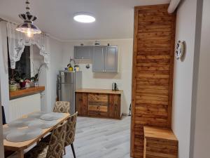 Kuchyň nebo kuchyňský kout v ubytování Apartamenty Łąkowa Piecki + 10 fotografií