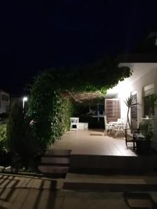 a view of a patio at night at Studio Sofia in Novalja