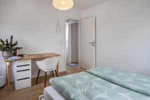 Postel nebo postele na pokoji v ubytování Ferienwohnung Kühn