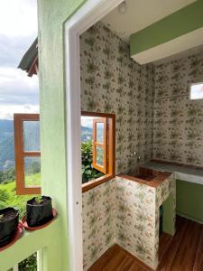 a room with a window and a view at Mountaintop Guest House in Bhurtuk