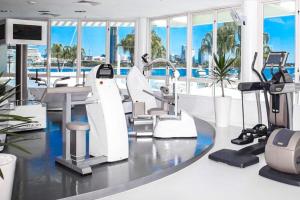 an office with a gym with a view of the city at Sheraton Grand Mirage Resort Gold Coast in Gold Coast