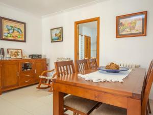 a dining room with a table and chairs and a mirror at North House - House In Platja De Muro Free Wifi in Playa de Muro