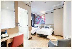 Postel nebo postele na pokoji v ubytování Hotel Bencoolen at Hong Kong Street
