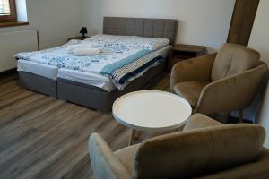 Postel nebo postele na pokoji v ubytování Chata Dolný Smokovec Správa TANAPu