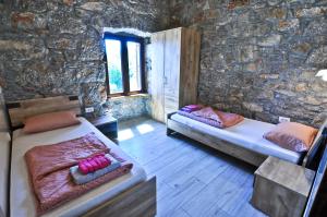 Postel nebo postele na pokoji v ubytování Casa Storia & Casa Antica
