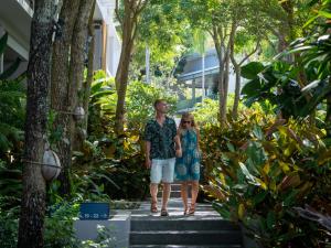 a woman and a girl walking down the stairs at Explorar Koh Phangan - Adults Only Resort and Spa in Haad Rin