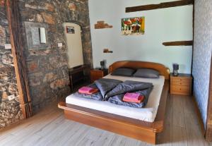 Postel nebo postele na pokoji v ubytování Casa Storia & Casa Antica