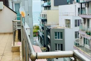 a view of the ocean from the balcony of a building at Studio Pomorie Tuthon in Pomorie