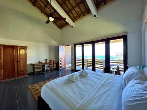 Postel nebo postele na pokoji v ubytování Balay Pacifico + 31 fotografií