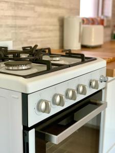 a white stove top oven in a kitchen at Location Location Vacation in Fremantle
