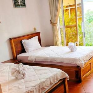 Cama o camas de una habitación en Ratana Bungalow - រតនា​បឹងហ្គាឡូ