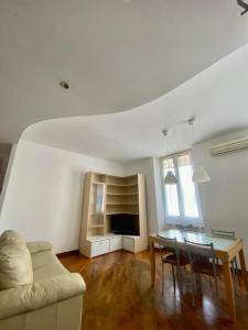 a living room with a couch and a table at Casa Giulia La Spezia in La Spezia