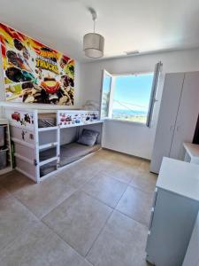 a room with a large window and a large painting on the wall at Nice, Magnifique villa vue mer avec piscine in Nice +30 photos