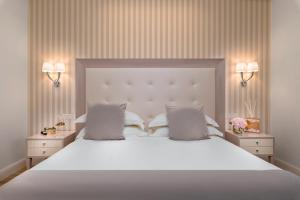Postel nebo postele na pokoji v ubytování Grand Hotel Gallia
