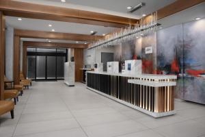 a lobby of a building with a reception desk at Fairfield Inn & Suites by Marriott New York Manhattan/Central Park in New York