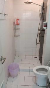 a bathroom with a shower and a toilet at Otto Stay BKK airport 10 mins, Near Malls & Night Market in Ban Khlong Lat Bua Khao