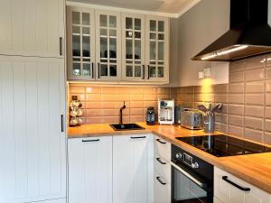 Köök või kööginurk majutusasutuses Rüm Hart Dünenkoje +15 fotot