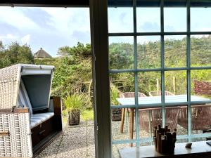 Rõdu või terrass majutusasutuses Rüm Hart Dünenkoje