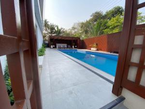 a swimming pool in the middle of a house at Hovah Luxury Suite in Accra