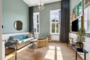 TV a/nebo společenská místnost v ubytování Hotel Kong Arthur