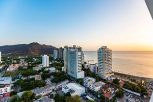 an aerial view of a city and the ocean at AC Hotel By Marriott Santa Marta in Santa Marta