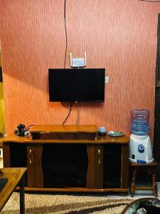 a desk with a television on top of it at Drish Haven in Nairobi