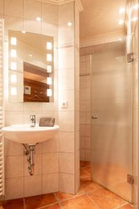 a bathroom with a sink and a shower at Lee in Juist +12 photos