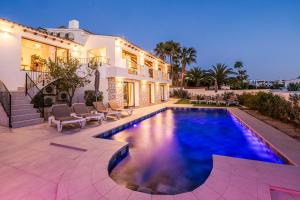 a house with a swimming pool in front of a house at Casa Buena Vista in Teulada