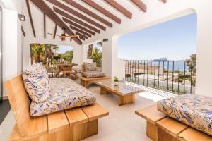 a living room with a view of the ocean at Casa Buena Vista in Teulada