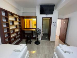 Postel nebo postele na pokoji v ubytování Hotel ZT