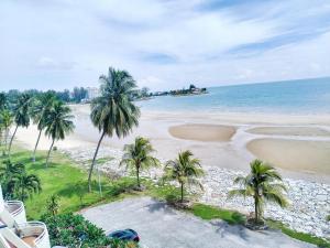 an aerial view of a beach with palm trees at Regency Tanjung Tuan Beach PD by Idealhub in Port Dickson