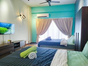 Katil atau katil-katil dalam bilik di Regency Tanjung Tuan Beach PD by Idealhub