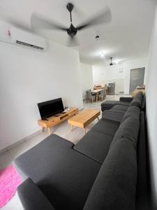 a living room with a couch and a table at 75 Suite (Tower B) in Papar