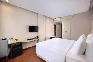 TV a/nebo společenská místnost v ubytování Four Star by Trans Hotel