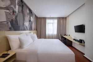 TV a/nebo společenská místnost v ubytování Four Star by Trans Hotel