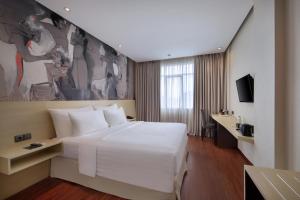 TV a/nebo společenská místnost v ubytování Four Star by Trans Hotel