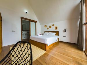 Postel nebo postele na pokoji v ubytování Catu Glamping Bedugul