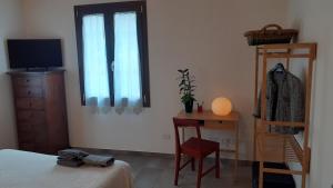 Postel nebo postele na pokoji v ubytování b&b Onda Verde