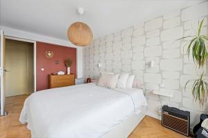 Postelja oz. postelje v sobi nastanitve Le Michelet - Appartement lumineux